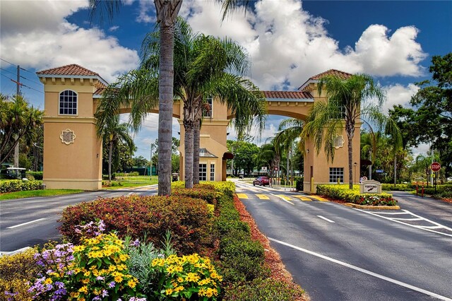 1020 New Winsor Loop Unit 46, Sun City Center, FL 33573 - view of asphalt street with traffic signs and street lights