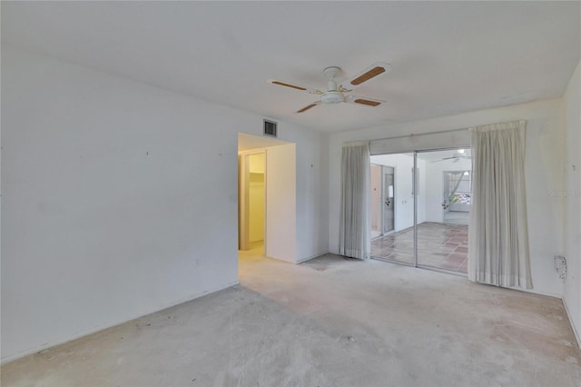 unfurnished room featuring carpet floors, ceiling fan, and visible vents