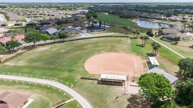 drone / aerial view with a residential view and a water view