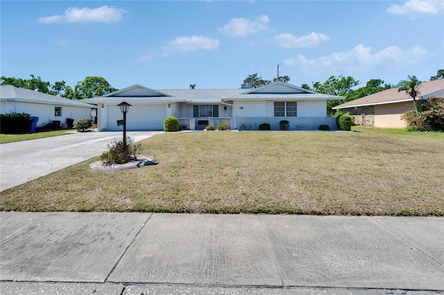 ranch-style home featuring a front yard, concrete driveway, stucco siding, and an attached garage