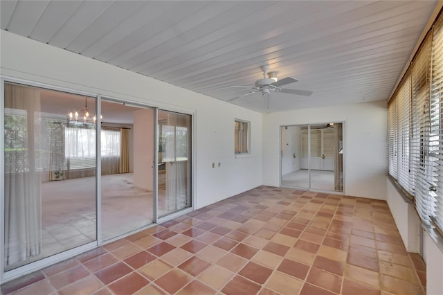 unfurnished sunroom featuring a notable chandelier