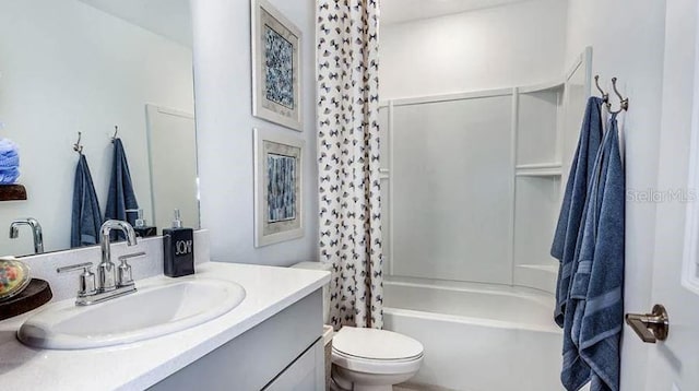 full bathroom featuring toilet, vanity, and shower / bathtub combination with curtain