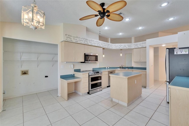 1034 Mcdaniel St Unit 1034, Sun City Center, FL 33573 - kitchen featuring visible vents, light countertops, ceiling fan with notable chandelier, appliances with stainless steel finishes, and a sink