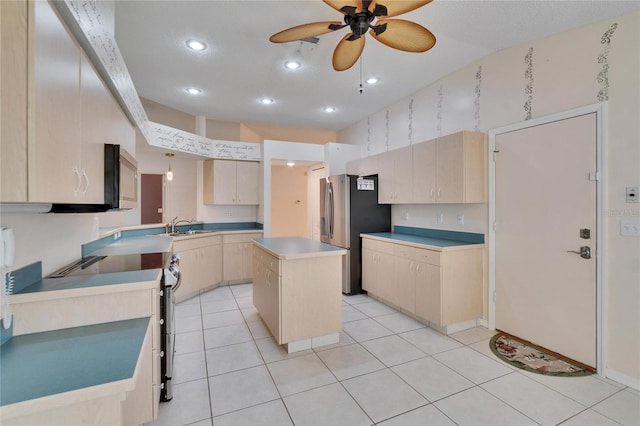 1034 Mcdaniel St Unit 1034, Sun City Center, FL 33573 - kitchen featuring light tile patterned floors, a ceiling fan, light brown cabinetry, and stainless steel appliances