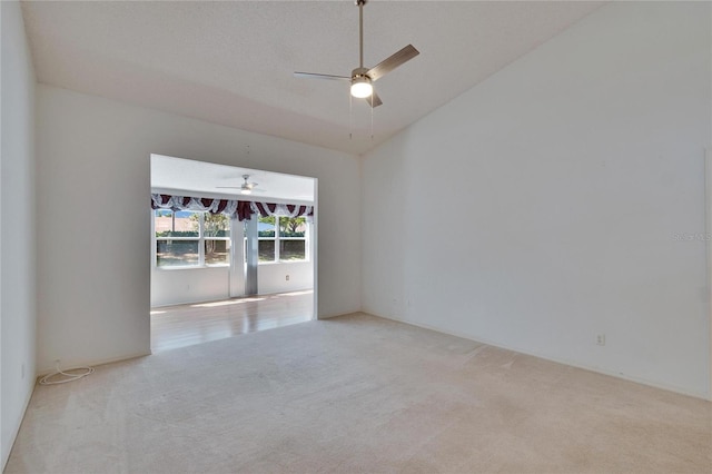 1034 Mcdaniel St Unit 1034, Sun City Center, FL 33573 - unfurnished room with carpet, ceiling fan, and vaulted ceiling