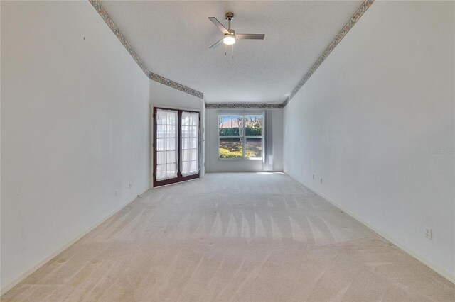 1034 Mcdaniel St Unit 1034, Sun City Center, FL 33573 - unfurnished room with a textured ceiling, light colored carpet, and ceiling fan