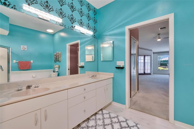 1034 Mcdaniel St Unit 1034, Sun City Center, FL 33573 - full bath featuring double vanity, visible vents, baseboards, and a sink