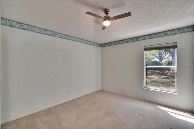 1034 Mcdaniel St Unit 1034, Sun City Center, FL 33573 - spare room with light colored carpet, a ceiling fan, and a textured ceiling