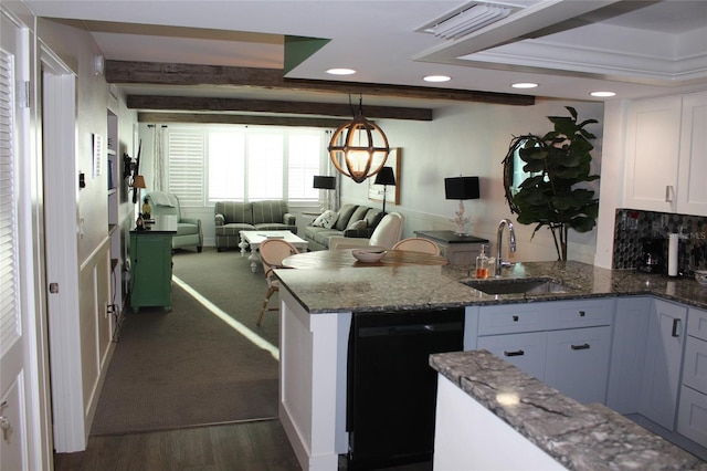 kitchen featuring beam ceiling, a sink, black dishwasher, open floor plan, and a peninsula