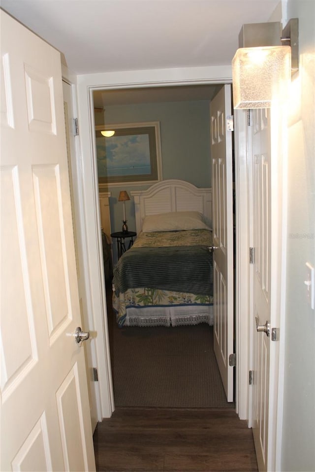 bedroom with wood finished floors