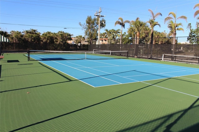 view of sport court featuring community basketball court and fence