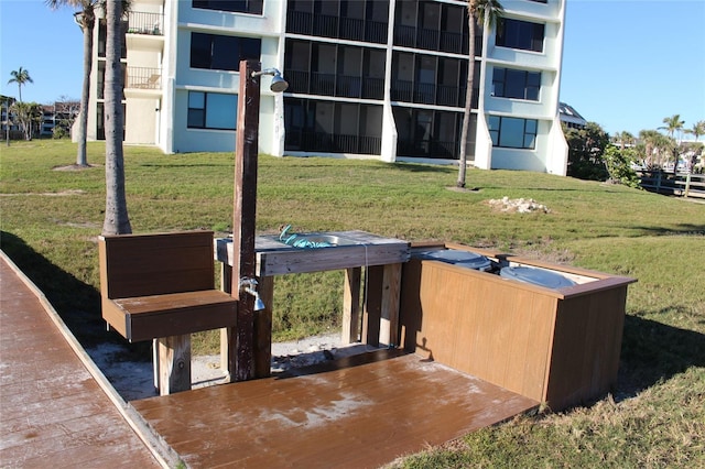 entry to storm shelter featuring a lawn