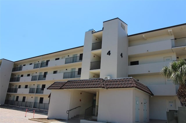 979 E Gulf Dr Unit D402, Sanibel, FL 33957 - view of building exterior with fence