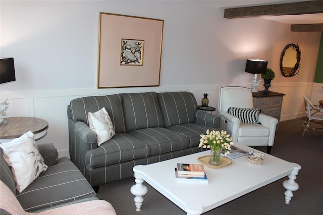 979 E Gulf Dr Unit D402, Sanibel, FL 33957 - living area featuring beamed ceiling, carpet, a decorative wall, and a wainscoted wall