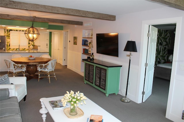 979 E Gulf Dr Unit D402, Sanibel, FL 33957 - living area featuring beam ceiling, carpet flooring, a notable chandelier, and visible vents