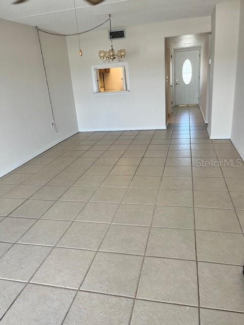 unfurnished room with light tile patterned floors