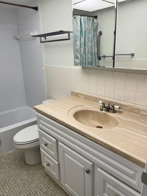 bathroom featuring vanity, shower / bathtub combination with curtain, tile walls, toilet, and tile patterned floors