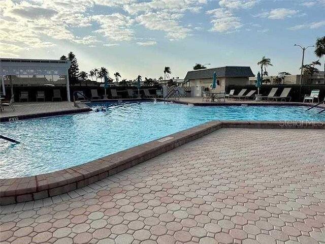 community pool with a patio