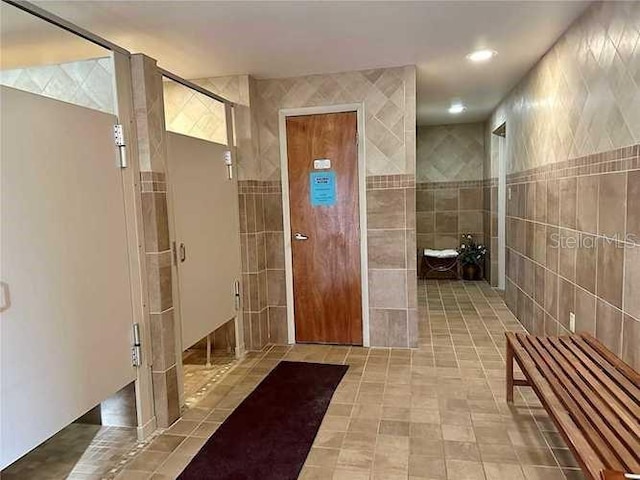 bathroom featuring tile walls