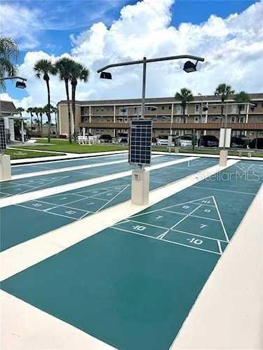 view of home's community with shuffleboard