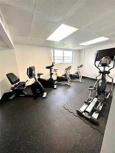 workout area with a drop ceiling