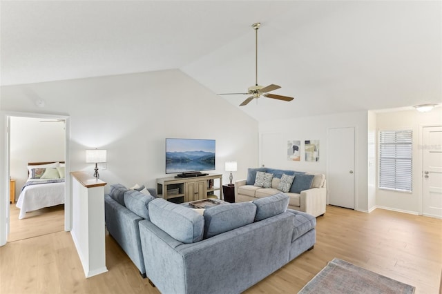 living area with light wood-style flooring, baseboards, high vaulted ceiling, and ceiling fan