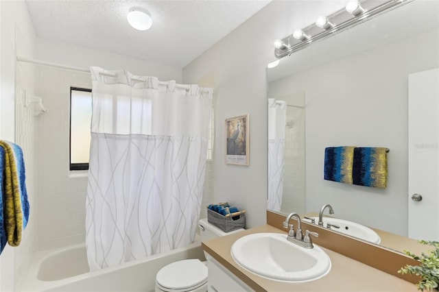 bathroom featuring toilet, vanity, a textured ceiling, and shower / tub combo with curtain