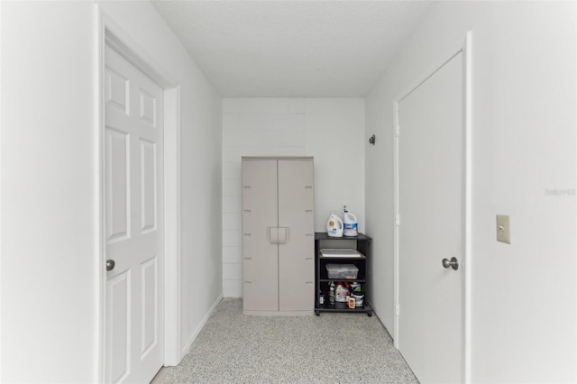 hallway with light speckled floor