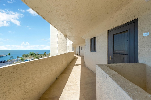 balcony featuring a water view