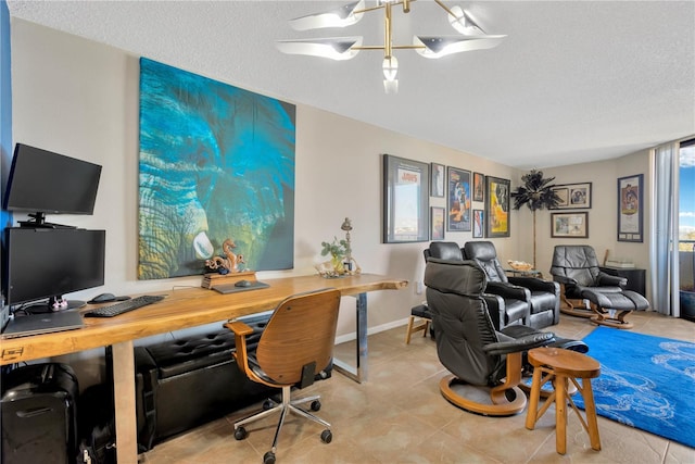 office area with a textured ceiling and tile patterned flooring