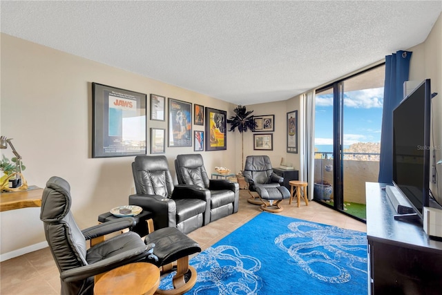 tiled living room featuring baseboards, a textured ceiling, and floor to ceiling windows