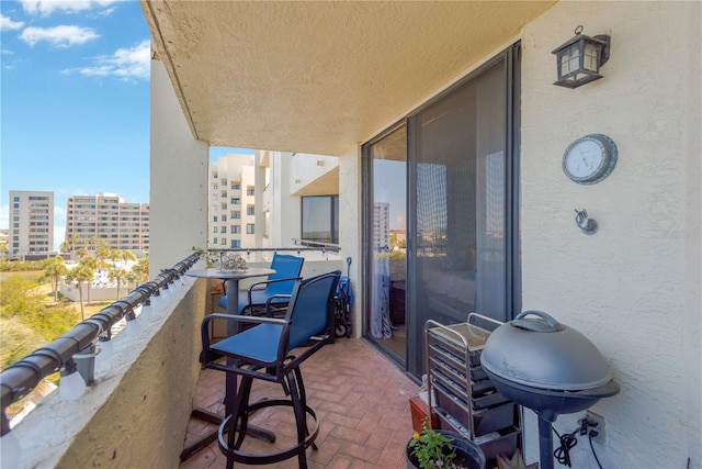 balcony featuring grilling area and a city view