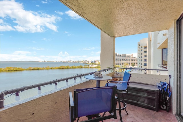 balcony with a city view and a water view