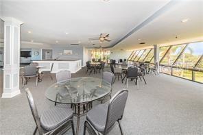 dining room with decorative columns and ceiling fan