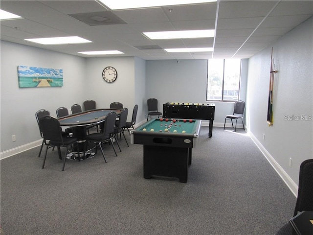 game room featuring carpet flooring, a paneled ceiling, and baseboards