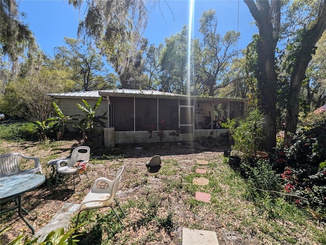 view of yard featuring a sunroom