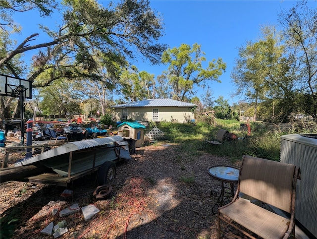 view of yard featuring central AC unit