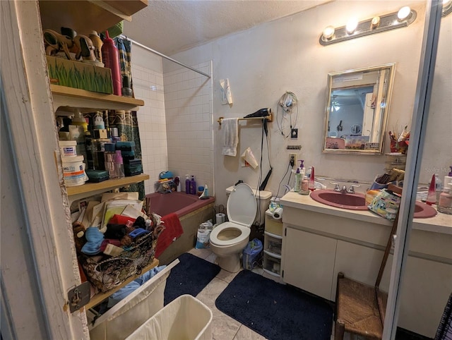 bathroom with toilet, vanity, shower / bathing tub combination, tile patterned floors, and a textured ceiling