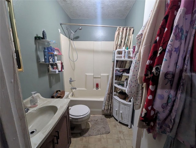 bathroom featuring toilet, vanity, tile patterned floors, shower / bath combination with curtain, and a textured ceiling