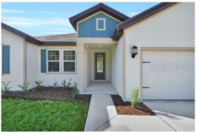 17526 SW 25th Cir, Ocala, FL 34473 - doorway to property featuring an attached garage, board and batten siding, and driveway
