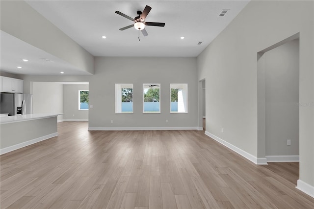 17526 SW 25th Cir, Ocala, FL 34473 - unfurnished living room with ceiling fan, light wood-type flooring, and recessed lighting