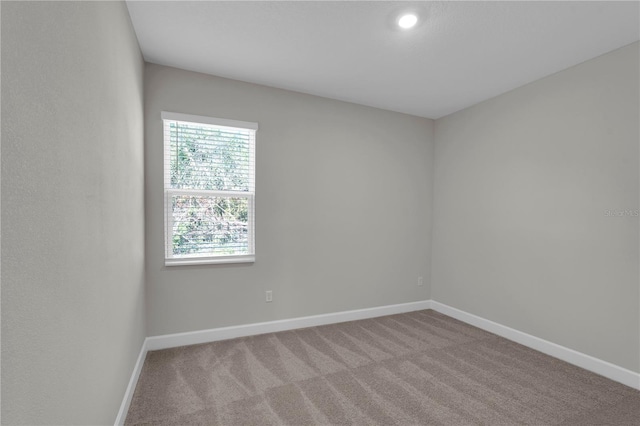 17526 SW 25th Cir, Ocala, FL 34473 - empty room featuring baseboards and carpet floors