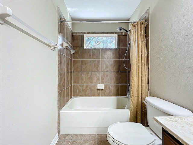 full bathroom with tile patterned floors, shower / tub combo with curtain, vanity, and toilet