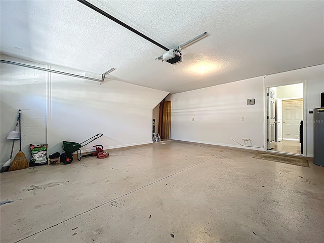 garage featuring a garage door opener and baseboards