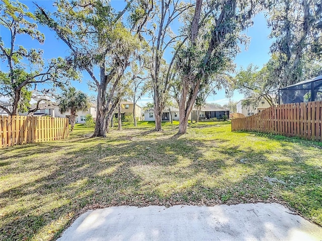 view of yard featuring a residential view and fence