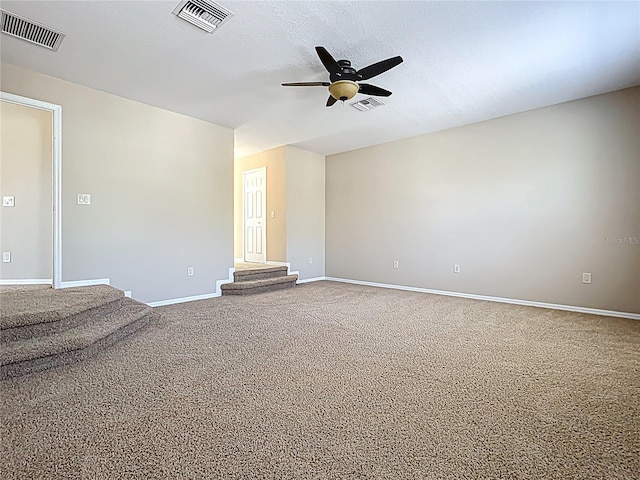 unfurnished room with visible vents, baseboards, and a ceiling fan