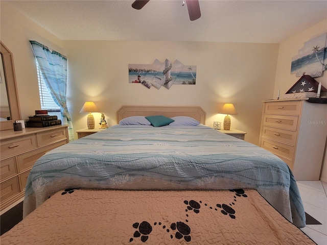 bedroom featuring light tile patterned flooring and a ceiling fan