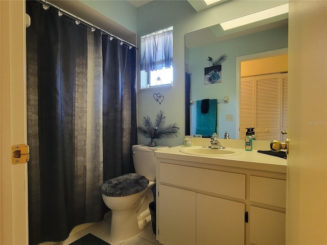 full bathroom with tile patterned flooring, a shower with shower curtain, toilet, and vanity