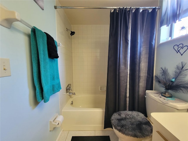 bathroom with vanity, toilet, shower / tub combo, and tile patterned flooring