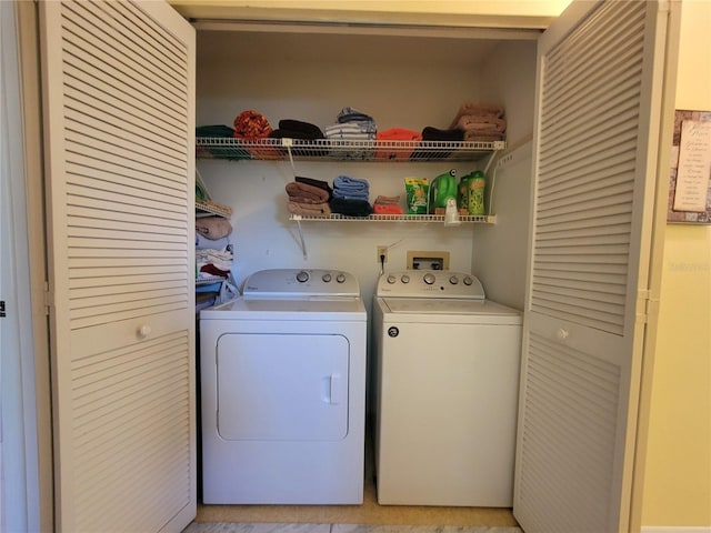 laundry area featuring laundry area and washing machine and clothes dryer